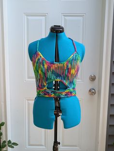 Large handmade crochet top with lace-up back in rainbow. 100% cotton. Sizing (Bust Measurement): XS = 28-30" S = 32-34" M = 36-38" L = 40-42" XL = 44-46" XXL = 48-50" For best care, hand wash or machine wash in delicates bag on a gentle cycle and lay flat to dry. Made from Sneak A Peek pattern (with slight modification for a smaller underbust keyhole) by Kelsie at PassioKnit Goods, passioknitgoods.com. Fitted Cotton Hippie Crochet Top, Fitted Cotton Crochet Hippie Top, Fitted Cotton Crochet Top In Hippie Style, Multicolor Stretch Cotton Crop Top, Hippie Cotton Crochet Top With Lace Details, Hippie Crochet Lace Cotton Top, Hippie Cotton Crochet Lace Top, Hippie Crochet Lace Top In Cotton, Fitted Multicolor Crochet Top With Crochet Trim