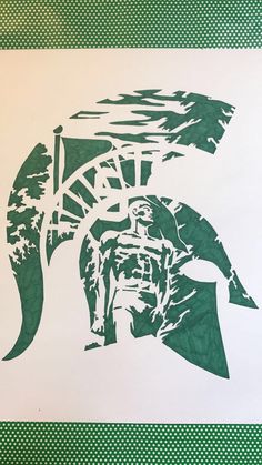 a green and white drawing of a spartan helmet