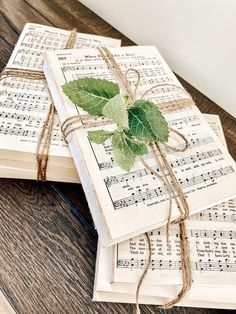 sheet music with green leaves tied to it