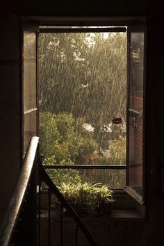 an open window with rain coming in