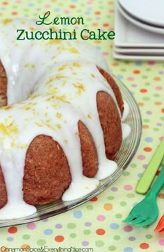 a lemon zucchini cake with icing on a plate