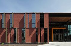 a brick building with many windows and doors