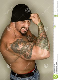 a man with tattoos on his arms and chest