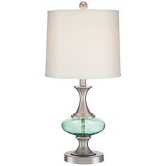 a glass table lamp with a white shade on the base and a silver metal base