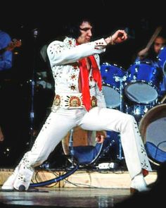 elvis presley performing on stage with his band