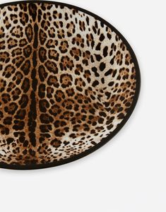 an animal print plate on a white background