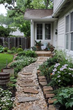 a stone path leading to a white house