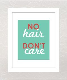 a framed print with the words no hair don't care in red and green