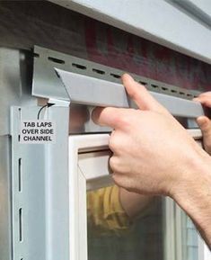 a person is opening the door to a microwave with their thumb on it's handle