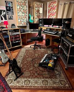 a room filled with guitars and musical equipment