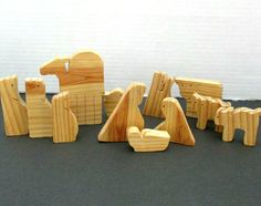 wooden toys are arranged in the shape of animals