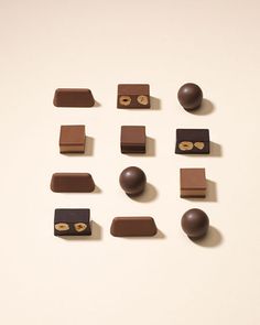 several chocolates are arranged on a white surface