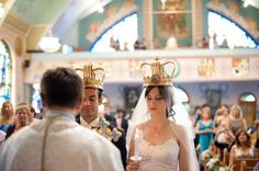 a bride and groom walking down the aisle