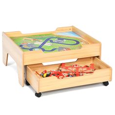 a wooden toy train table with two drawers