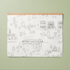 a paper with a drawing of a town on it