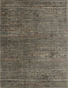 a gray rug with an intricate design on the front and back side, in grey tones