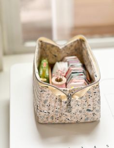 an open purse sitting on top of a white table