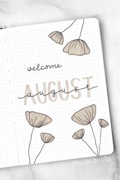 an open notebook with the words welcome august written on it and flowers drawn in pencil