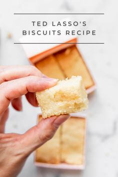 a person holding a piece of cake in their hand with the words ted lasso's biscuits recipe