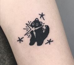 a small black bear tattoo on the right arm and leg, with stars around it