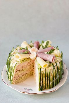 a cake on a plate with one slice cut out