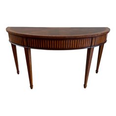 an oval shaped table with two legs and a curved top on one end, against a white background