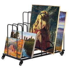 a rack with paintings and pictures on it