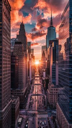 the sun is setting over new york city's skyscrapers in this aerial photo