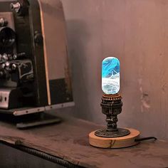 a table with a lamp on it next to a toaster oven and coffee machine