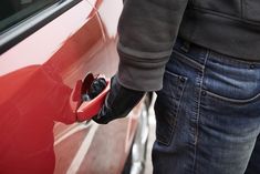 a man is filling his car with gas