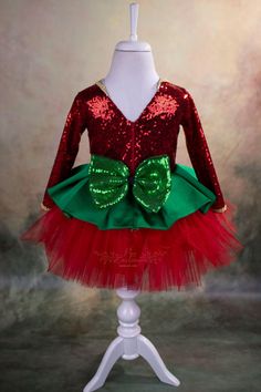 Are you looking for a cute and play friendly party dress for your little girl for Christmas and Holidays? This sweet reindeer Christmas tutu is just perfect for that! It is made of the highest quality satin, sequin, abraham fabric and crystal tulle. It has a V-shape back with a zipper and a big sequin bow. It has a soft satin lining to prevent irritation on the delicate skin of your child. The reindeer headband is included. The Christmas tutu is handmade and will be customized for your little gi Princess Style Christmas Party Dress, Christmas Costume Party Holiday Dress With Long Sleeves, Christmas Long Sleeve Holiday Dress For Costume Party, Christmas Costume Party Dress With Long Sleeves, Long Sleeve Christmas Holiday Dress For Costume Party, Holiday Princess Dress For Party Season, Christmas Princess Costume Dress, Christmas Celebration Dress With Long Sleeves, Red Princess Dress For Christmas Dress-up