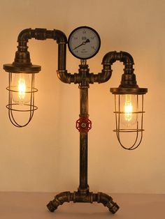 an old fashioned lamp with two lamps attached to it and a clock on the side