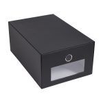 a black box with a silver ring on the front and bottom door is open to reveal an empty drawer