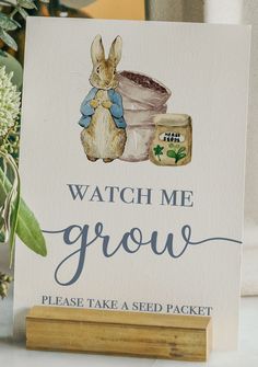 a card that says watch me grow with a potted plant in the background and an illustration of a bunny