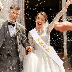 the newly married couple are showered with confetti