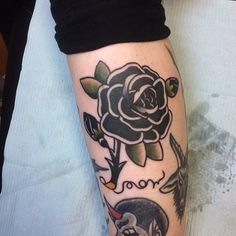 a woman's leg with tattoos on it and an image of beauty and the beast