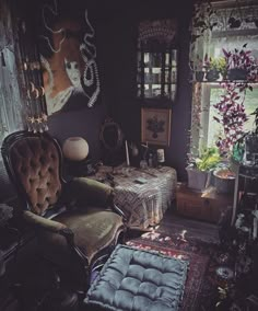 a living room filled with lots of furniture next to a table and window sill