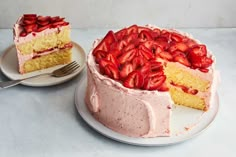 there is a cake with strawberries on it and a fork next to the cake