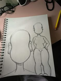 a drawing of a man's head and torso next to a computer mouse on a desk