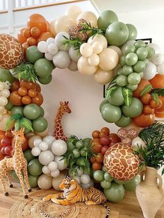 a wreath made out of balloons and giraffes