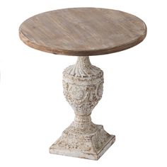 an old white pedestal with a wooden table top