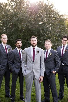 a group of men in suits standing next to each other