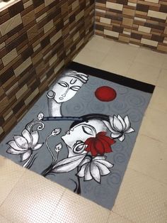 the bathroom is decorated with an artistic painting on the floor and rugs that look like flowers