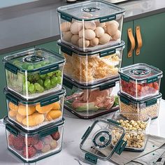 several containers filled with food sitting on top of a counter