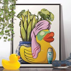 a yellow rubber duck sitting next to a potted plant