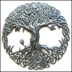 an intricate metal tree of life brooch