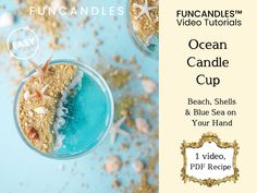 the ocean candle cup has shells and blue sea on it, and is surrounded by starfish