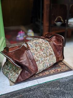 "Leather Fabric Duffle Bag Really Special and amazing Piece!! Amazing piece, really vintage and in good condition (only small sigs of use). Measures: W: 24.80\" (63 cm) Tall: 11.81\" (30 cm) Deep: 9.84\" (25 cm) Adjustable strap: 49.21\" (125 cm) Thanks for stopping by!!" Aesthetic Duffle Bags, Vintage Weekender Bag With Leather Lining For Travel, Vintage Travel Duffle Bag With Leather Lining, Vintage Leather-lined Duffle Bag For Travel, Vintage Duffle Bag With Leather Handles For Overnight Trips, Vintage Weekender Bag With Luggage Sleeve For Travel, Vintage Weekender Bag For Travel, Vintage Brown Weekender Bag For Travel, Vintage Leather-backed Satchel Weekender Bag