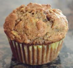 a muffin sitting on top of a wooden table