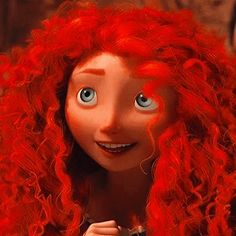 a red haired woman with blue eyes and long hair